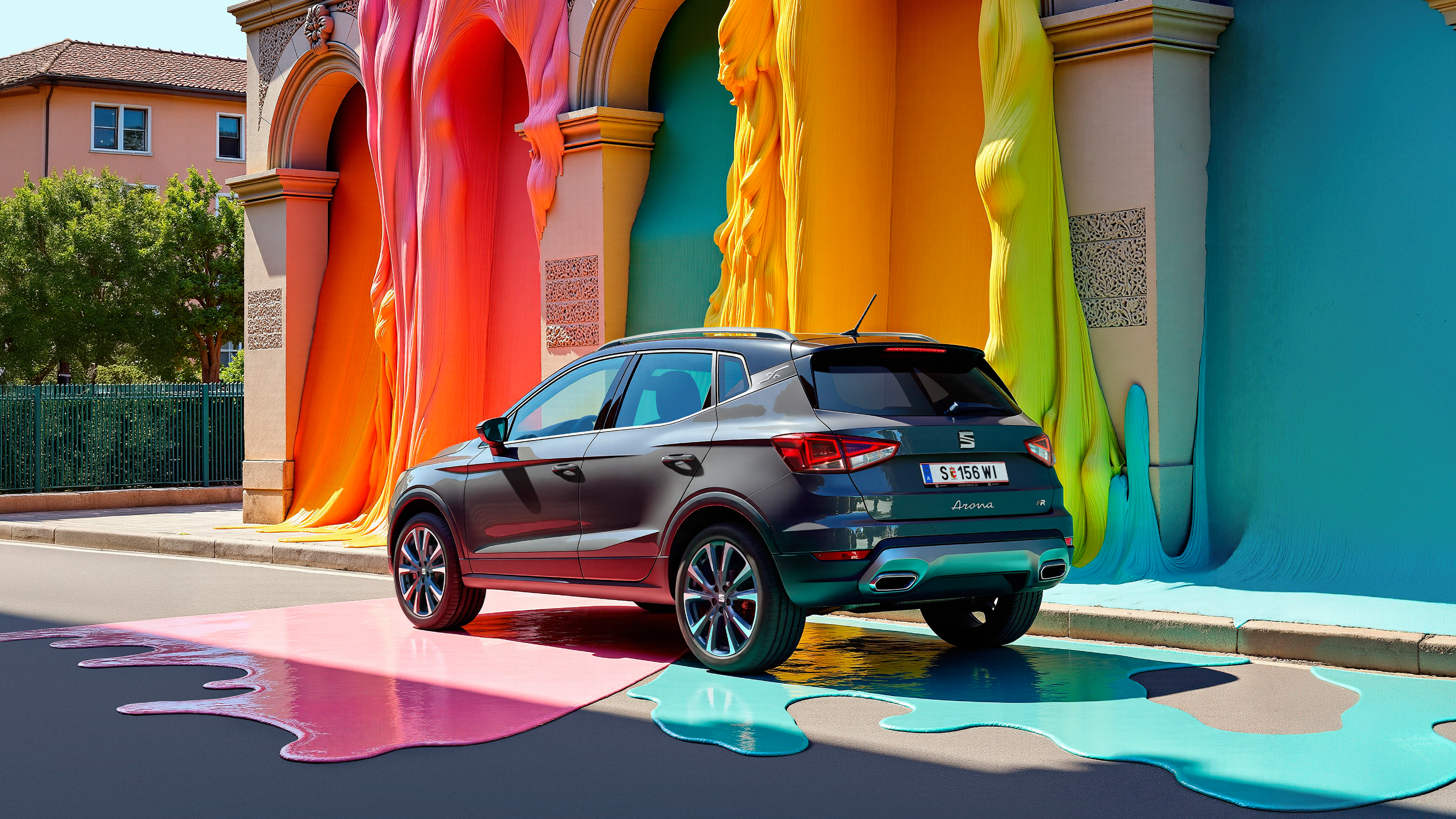 SEAT Arona Seitenansicht mit Haus und bunter Farbe im Hintergrund